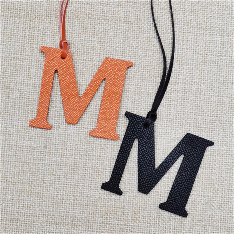 XMESSUN พวงกุญแจหนังแท้รูปตัวอ - Monogram Keychain Leather บทวิจารณ์และราคา